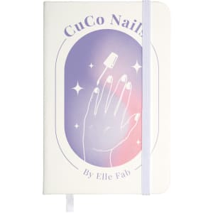 A white pocket notebook with an illustration of a hand and nail polish against a gradient background. It has a logo.