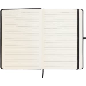 An open A5 notebook with lined pages and a black binding.