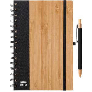 A bamboo notebook with a black fabric cover and a black pen attached. It features a spiral binding and a logo.