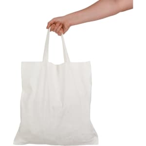 A hand holding a white short handle bamboo tote bag. The bag features two sturdy handles.