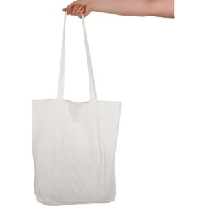 A white tote bag with long handles, held by a hand, featuring a logo.