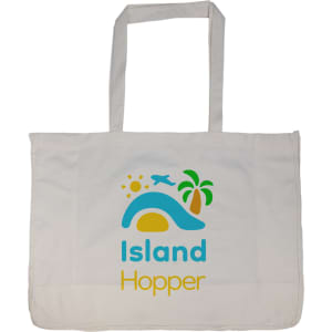 A large cream reusable grocery bag with blue and yellow designs featuring sun, palm tree, and airplane motifs.