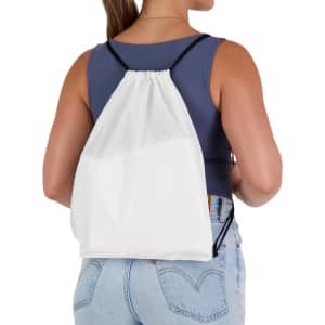 A white drawstring backpack is worn on the back of a person, featuring black straps and a simple design.