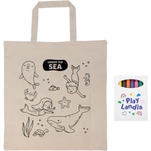 A beige calico bag with sea-themed outlines and a pack of colorful crayons. The bag has a logo.