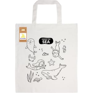 A cream cotton bag featuring whimsical sea-themed illustrations, including sea creatures and children, with a logo.