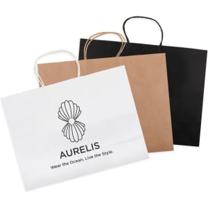 Three extra large paper bags in white, brown, and black, featuring handles and a logo on the front of the white bag.