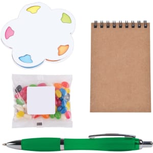 A green pen, a notepad, a flower-shaped sticky note set, and a bag of colorful jelly beans.