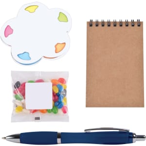 A blue pen, a notepad, colorful sticky notes, and a pouch of jelly beans on a white background.