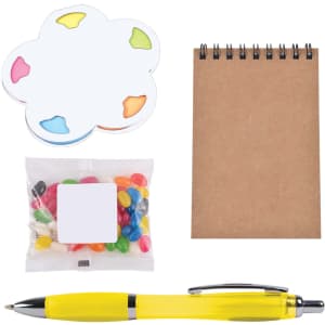 A yellow pen, a notepad, a pack of jelly beans, and a flower-shaped sticky note set.
