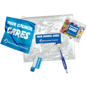 An intro pack containing a clear pouch, lip balm, a pen, and a snack bag with colorful jelly beans.
