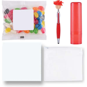 A red lip balm tube, a colorful bag of jelly beans, a red pen, a white cloth, and a transparent pouch.