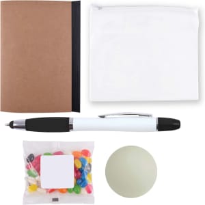 A brown notebook, a clear pouch, a black and white pen, a bag of colorful jelly beans, and a green stress ball.