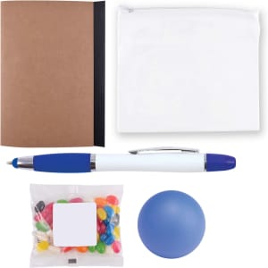 A notebook with a brown cover, a white zip pouch, a blue pen, a bag of colorful jelly beans, and a blue stress ball.
