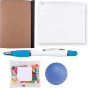 A notebook with a brown cover, a clear zip pouch, a blue pen, a pack of colorful jelly beans, and a blue stress ball.