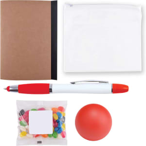 A notebook, a zippered pouch, a red and white pen, a bag of multicolored candies, and a red stress ball.