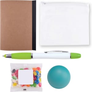 A notebook with a brown cover, a white zip pouch, a green and white pen, a teal stress ball, and a bag of colorful candy.