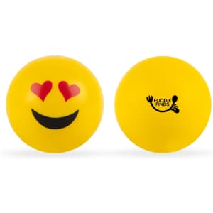 Two yellow stress balls featuring emoji designs—one with a smiling face and the other with heart eyes—plus a logo.