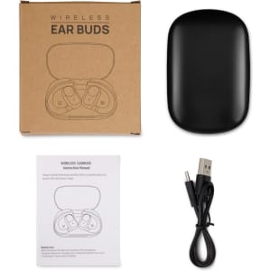 A set of black wireless ear buds inside a charging case, with a USB cable and instruction manual beside them.