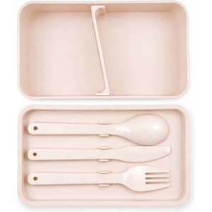 A light pink eco lunch box featuring a divider and matching cutlery set including a spoon, fork, and knife.