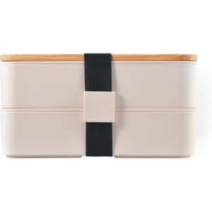 A Stax Eco Lunch Box in soft pink with a bamboo lid and a black elastic strap for secure closure.