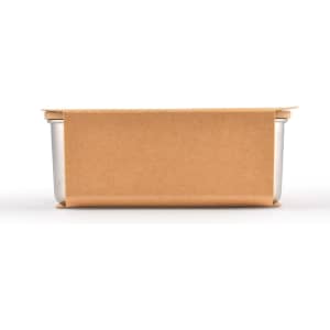A lunch box with a sleek metal container wrapped in a brown kraft paper sleeve.