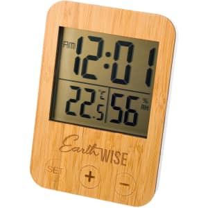 A digital weather station featuring a bamboo frame, displaying the time, temperature, and humidity levels.