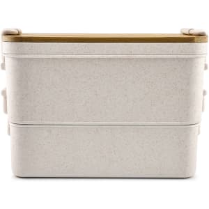 A dual-compartment lunch box in a light, speckled colour with a wooden lid and a simple, modern design.