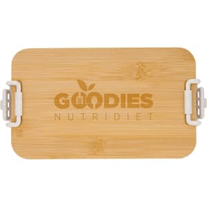 A bamboo lunch box with dual compartments, featuring a light natural finish and a logo on the lid.