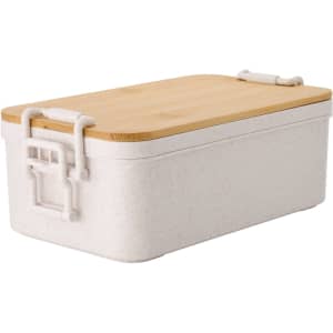 A white dual-compartment lunch box with a bamboo lid and clips, featuring a minimalist design.