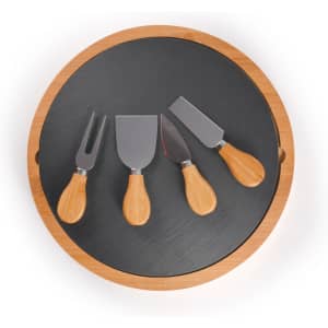 A round bamboo cheese board with a slate surface and four metal cheese knives with bamboo handles.