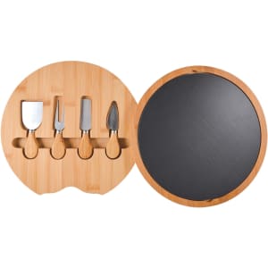 A round bamboo cheese board with a slate surface, featuring four stainless steel cheese utensils.