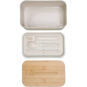 A bamboo lunch box with a clear lid and a removable compartment containing a spoon, fork, and knife.