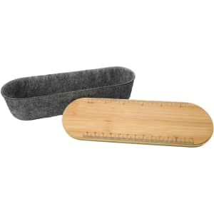 A utility case featuring a felt interior and a bamboo lid designed with a ruler. The case has an elongated oval shape.