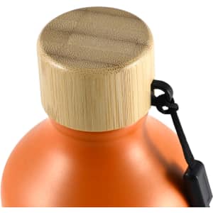 A drink bottle in vibrant orange with a bamboo lid and a black attachment loop. Features a logo.