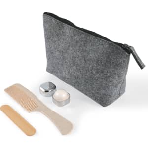 A grey cosmetic pack featuring a zippered bag, a comb, a wooden spatula, and two containers.