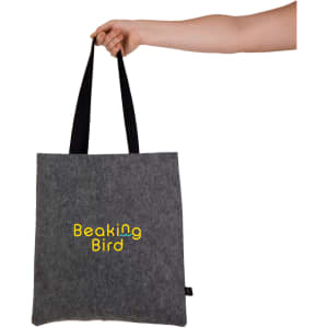 A grey felt tote bag with black handles and branding visible on the front.