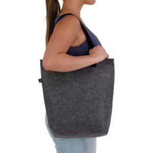 A grey RPET tote bag with a gusset, featuring a logo, held by a person from the side.