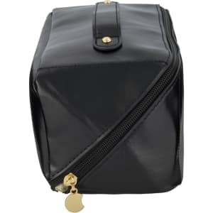 A black toiletry bag featuring a zip closure, gold accents, and a structured design. It has a logo.