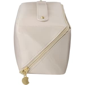 A cream-coloured toiletry bag with a gold zipper and button closure, featuring a logo on the exterior.