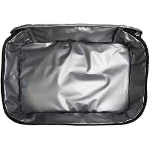 A grey cooler bag with a spacious, insulated interior. The bag features a zippered closure and a smooth, shiny lining.