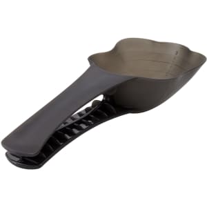 A pet food scoop in dark grey with a measuring section and a handle for easy grip. The product has a logo on it.