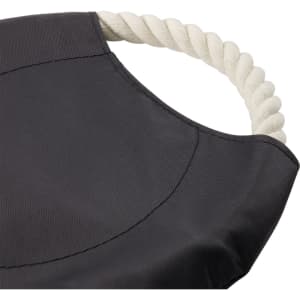 A round dog toy in black fabric with a white rope handle. The toy features a smooth, textured surface.