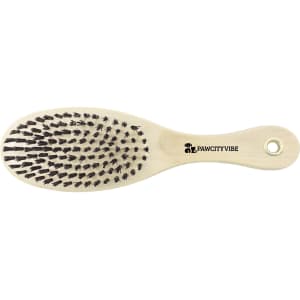 A pet grooming brush with a wooden handle and black bristles, featuring a logo on the handle.