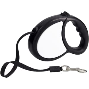 A black retractable dog lead with a handle and a clip for attachment. The lead has a solid casing and a nylon strap.
