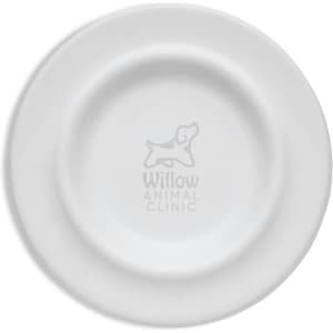 A white pet bowl with a circular design and an embossed logo in the centre.