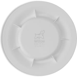 A white pet bowl featuring a logo, with a round design and raised sections around the edge.