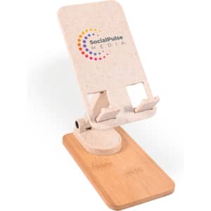 A phone stand made from light-coloured material with a wooden base, featuring a logo on the front.