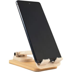 A wooden phone stand in natural tones, supporting a smartphone at an angle. Features a simple, modern design.