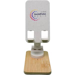 A phone stand featuring a natural bamboo base and a light-colored, textured top with a logo.