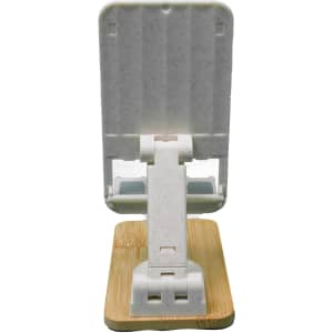 A white phone stand with a bamboo base, designed for holding mobile devices securely.
